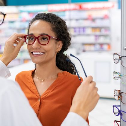 African,Young,Woman,In,Optic,Store,Choosing,New,Cool-down,Glasses African,Young,Woman,In,Optic,Store,Choosing,New,Cool-down,Glasses